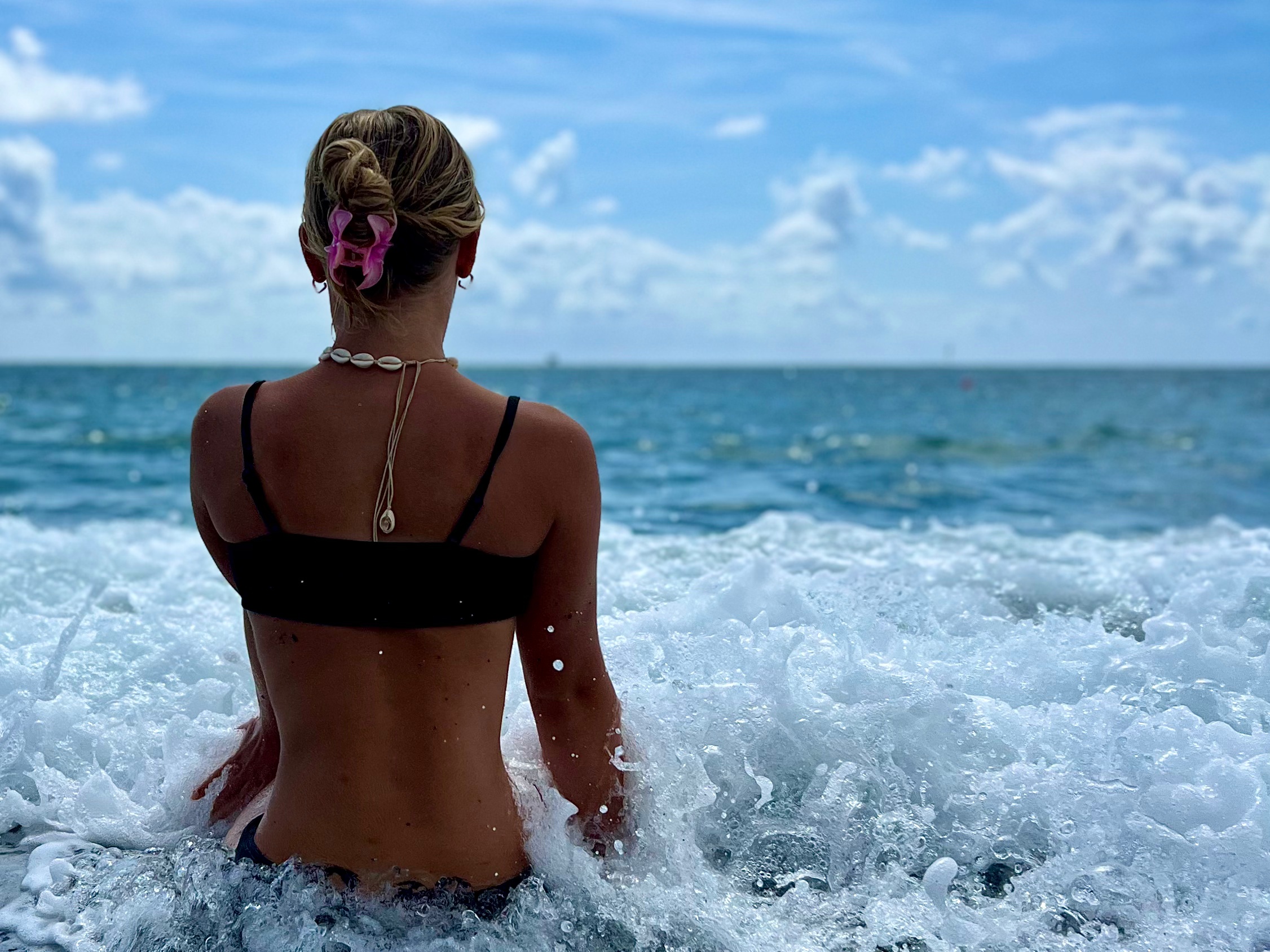 Where to go in Italy with kids - a teen girl at the beach in Genoa